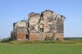 Photograph of an abandoned, weathered home found standing