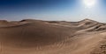 Photograph of Abu Dhabi desert with car tires marks in the sand Royalty Free Stock Photo