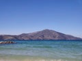 Photograph of the Adriatic sea from Albania against a pristine blue sky during the morning