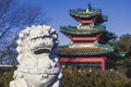 A Lion Statue Keeps Watch over an Asian-Style Building at Robert D. Ray Asian Gardens in Des Moines, Iowa