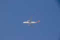 Photograph of a big white flying airplane in the sky Royalty Free Stock Photo