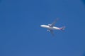 Photograph of a big white flying airplane in the sky Royalty Free Stock Photo