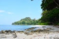 Neil`s Cove at Radhanagar Beach, Havelock Island, Andaman & Nicobar, India - Azure Water, Blue Sky, Stones and Greenery Royalty Free Stock Photo