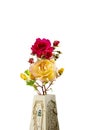 Photograph of a bouquet of natural flowers in a handmade vase on a white background.The photo has copy space to put text or Royalty Free Stock Photo