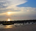 Bright Golden Yellow Sunlight with Pattern of White Clouds in Morning Sky at Stony Beach - Natural Background Royalty Free Stock Photo