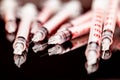 Close-up View of Multiple Insulin Syringes Scattered on a Reflective Dark Surface, Focus on Tips Royalty Free Stock Photo