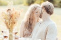 Intimate Moment at a Sunlit Table