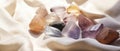 Assorted Colored Rocks Arranged on a White Cloth in a Photo Royalty Free Stock Photo