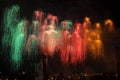 Colourful fireworks in the night sky over city