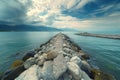 A photograph capturing the view of a lengthy pier stretching out into the vast expanse of the ocean, Sky-high panoramic view of a