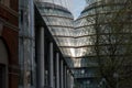 Photograph of City Hall, London taken from the rear at dusk. Building is reflected in the glass facade of the adjacent building. Royalty Free Stock Photo