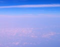 Altocumulus and Stratiform Clouds in Infinite Blue Sky with Shades of Pink - Aerial View - Abstract Natural Background Royalty Free Stock Photo