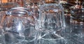 Photograph depicting glasses stacked upside down, details.