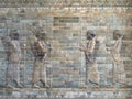 Ancient artistic wall of babylonian soldiers and archers