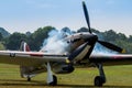 A photograph documenting the smoke coming from the exhausts in f