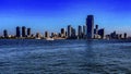 Photograph of the fabulous New York skyline, seen from a boat that has sailed to Liberty Island. Royalty Free Stock Photo