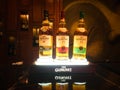 Photograph of Glenlivet bottles arranged on a beautifully lit stand
