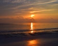 Golden Sun Rising at Horizon with Reflection in Sea Water with Colors in Sky - Kalapathar Beach, Havelock Island, Andaman, India Royalty Free Stock Photo