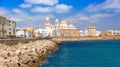 Groyne in CÃ¡diz with the Cathedral of Saint Cross in the background