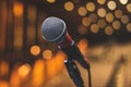 Concert Backstage - Microphone On The Theater Stage Before The Show With Empty Seats And Blurred Lights Royalty Free Stock Photo