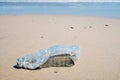 Photograph that illustrates the incitement of vacationers who throw garbage and plastic on the beach, dirtying and polluting it