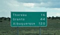 Highway sign for the towns of Thoreau, Grants and Albuquerque