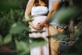 photograph of intimate moment between pregnant wife and husband