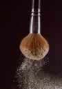 Isolated make-up powder with brush on black background Royalty Free Stock Photo