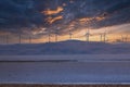 Photograph of Wind Turbines on a hill ridge line around Lake George in Australia Royalty Free Stock Photo