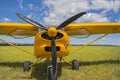 Photograph of a light aircraft in grassy field. Propeller plane close up, The blades of the aircraft closeup Royalty Free Stock Photo