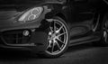 Photograph of a luxury black sportscar Porsche on a street Royalty Free Stock Photo