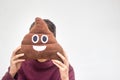 Man with poop emoji cushion