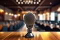 A photograph with the microphone in focus above the lecture hall lectern. Generative AI