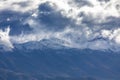 Photograph of a mountain range covered in low level clouds in New Zealand