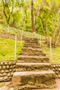 Natural stone landscaping in home garden with stairs Royalty Free Stock Photo