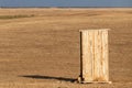 Photograph of an old rural outhouse or toilet in steppe. Single wooden building Royalty Free Stock Photo