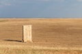 Photograph of an old rural outhouse or toilet in steppe. Single wooden building Royalty Free Stock Photo