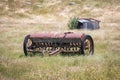 Photograph of an old grain harvester in an agricultural field Royalty Free Stock Photo