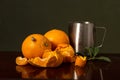 Citrus Symphony: Oranges and Tangerines with Crawling Grid and Metal Milk Can on a Dark Background