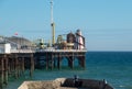 Photograph of Palace Pier on the Brighton UK sea front, showing the rides at the far end of the Pier including the helter skelter. Royalty Free Stock Photo