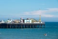 Photograph of Palace Pier on the Brighton UK sea front, showing the rides at the far end of the Pier including the helter skelter. Royalty Free Stock Photo