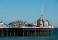 Photograph of Palace Pier on the Brighton UK sea front, showing the rides at the far end of the Pier including the helter skelter. Royalty Free Stock Photo