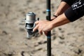 photograph picking up fishing rod reel surfcasting style