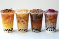 Photograph presenting four boba tea in plastic cups isolated on white background Royalty Free Stock Photo