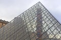 Photograph of Pyramid of the Louvre museum with colored balloons inside