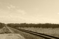 photograph retro sepia worn old rural train tracks transportation railway countryside transport rails deserted freight track