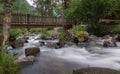 beautiful place where you can appreciate the river that crosses the forest passing under a bridge and continues down the mountain. Royalty Free Stock Photo