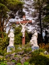 Roadside crucifix and holy statues Royalty Free Stock Photo