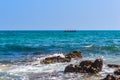 Photograph of Rowing Boat in Sea taken from a distance