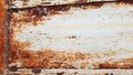Photograph of a rusty steel door with peeling paint